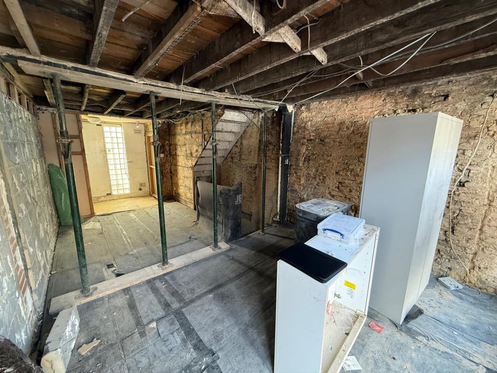 Lot: 88 - MIXED USE BUILDING FOR IMPROVEMENT AND REPAIR - Commercial premises in shell condition looking front to back